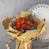 Vibrant Orange Roses Vintage Newspaper Wrap Dubai | باقة جوري برتقالي نابضة بتغليف ورق الصحف القديم دبي